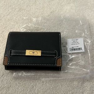 Tory Burch “T” Strap tri fold wallet.